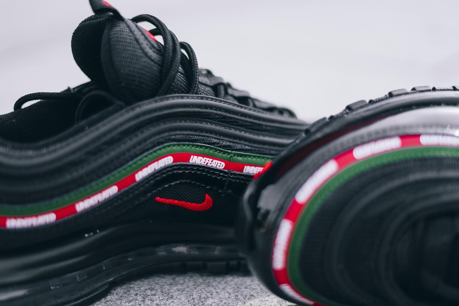air max 97 undefeated black on feet