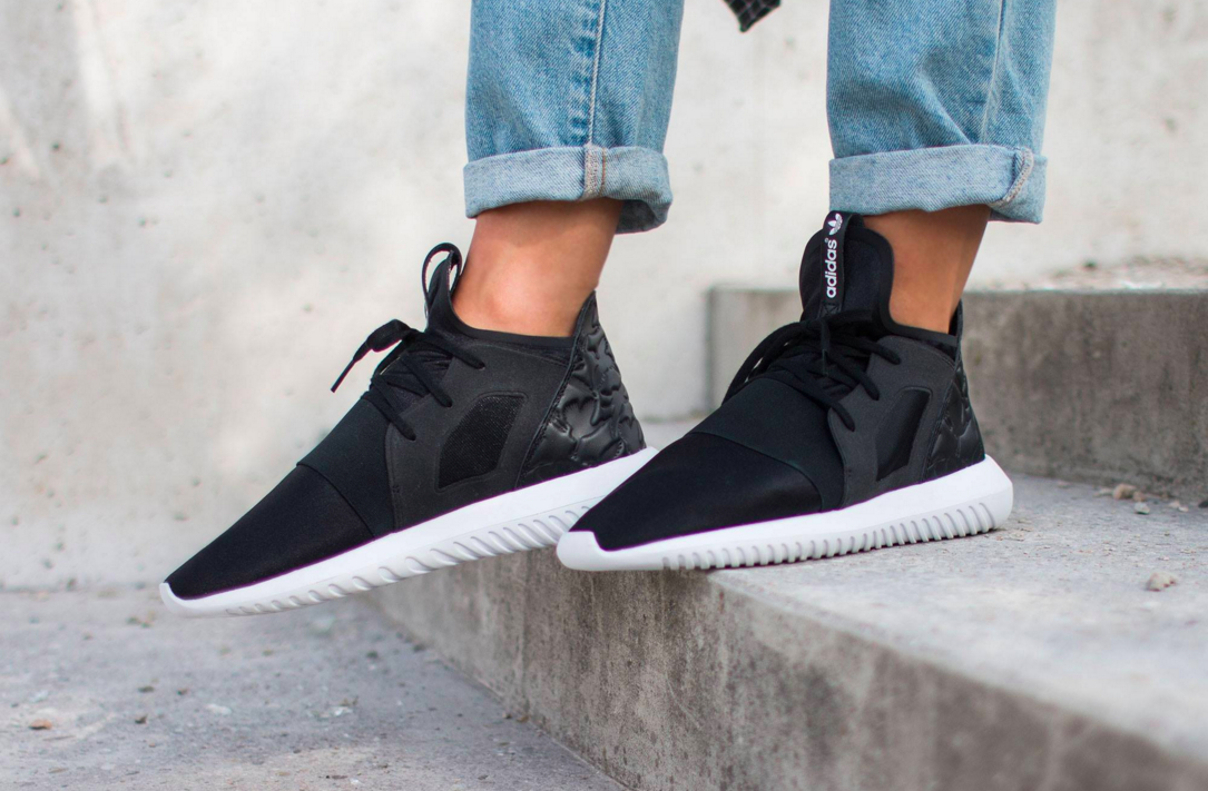 white and black adidas tubular